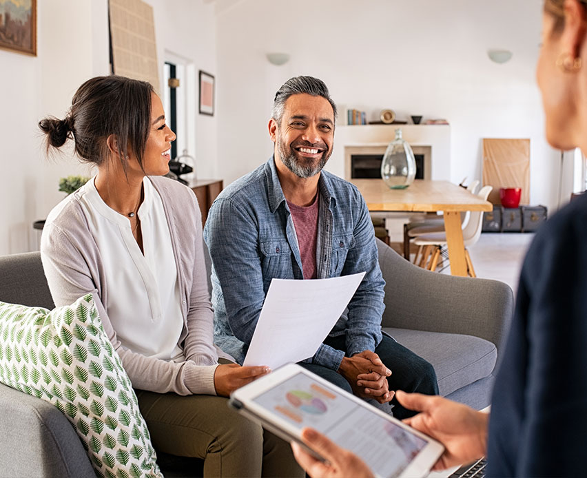couple meeting with financial advisor to discuss wealth management